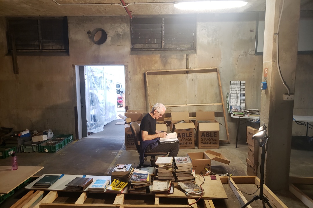 Wide view of the archive room showing concrete pillars and shelving