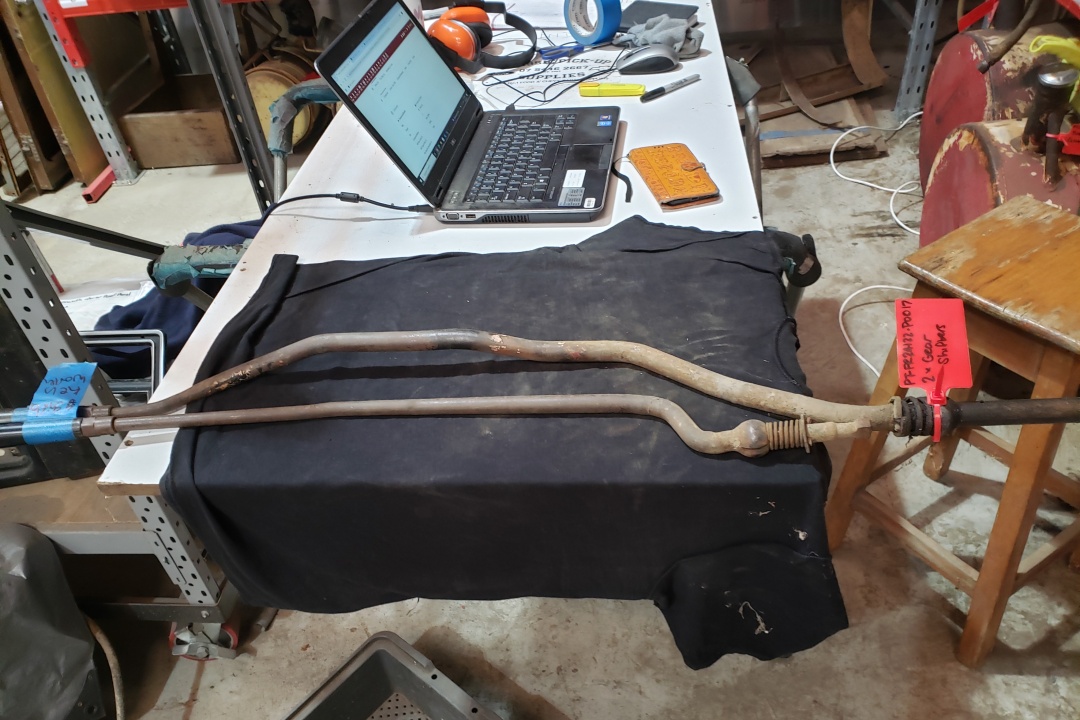 Close-up of manuals, crates and parts being catalogued